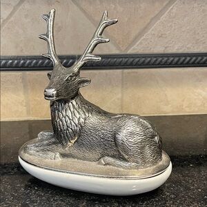 Silver metal deer covered dish keeps valuables near while hiding in plain sight